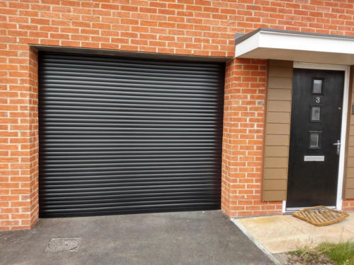 Black electric roller garage door